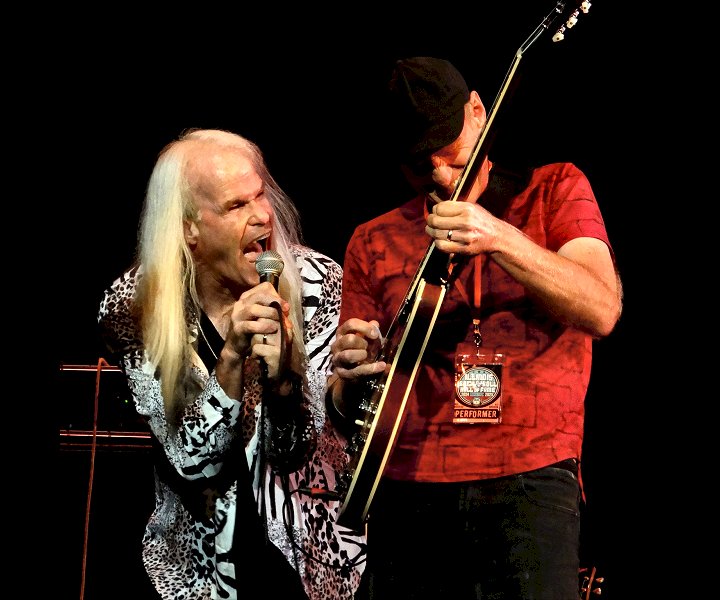 Head East lead vocalist Darren Walker and lead guitarist Mark Murtha performing live at the Rialto Square Theatre in Joliet, IL - photo by Tom Cullen