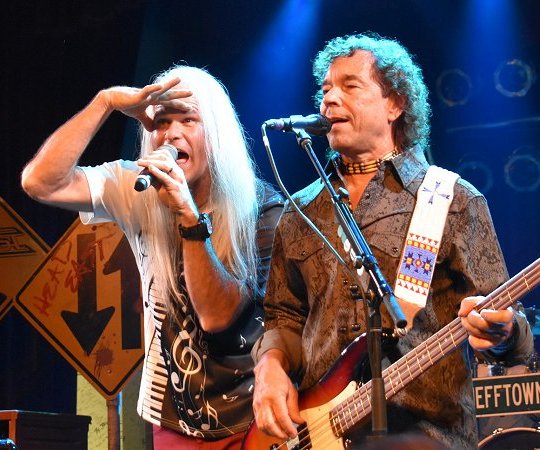 Head East lead vocalist Darren Walker and bass player and guitarist Greg Manahan performing live at the Surf Ballroom in Clear Lake, IA - photo by Jody Andresen